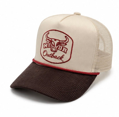 A trucker-style baseball cap with an off-white front panel and mesh back, featuring a dark brown corduroy brim and a red embroidered 'Major Outback' bull logo on the front.
